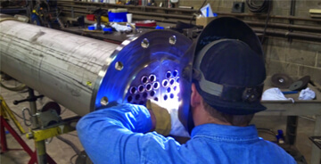 Welder working on a custom fabrication project